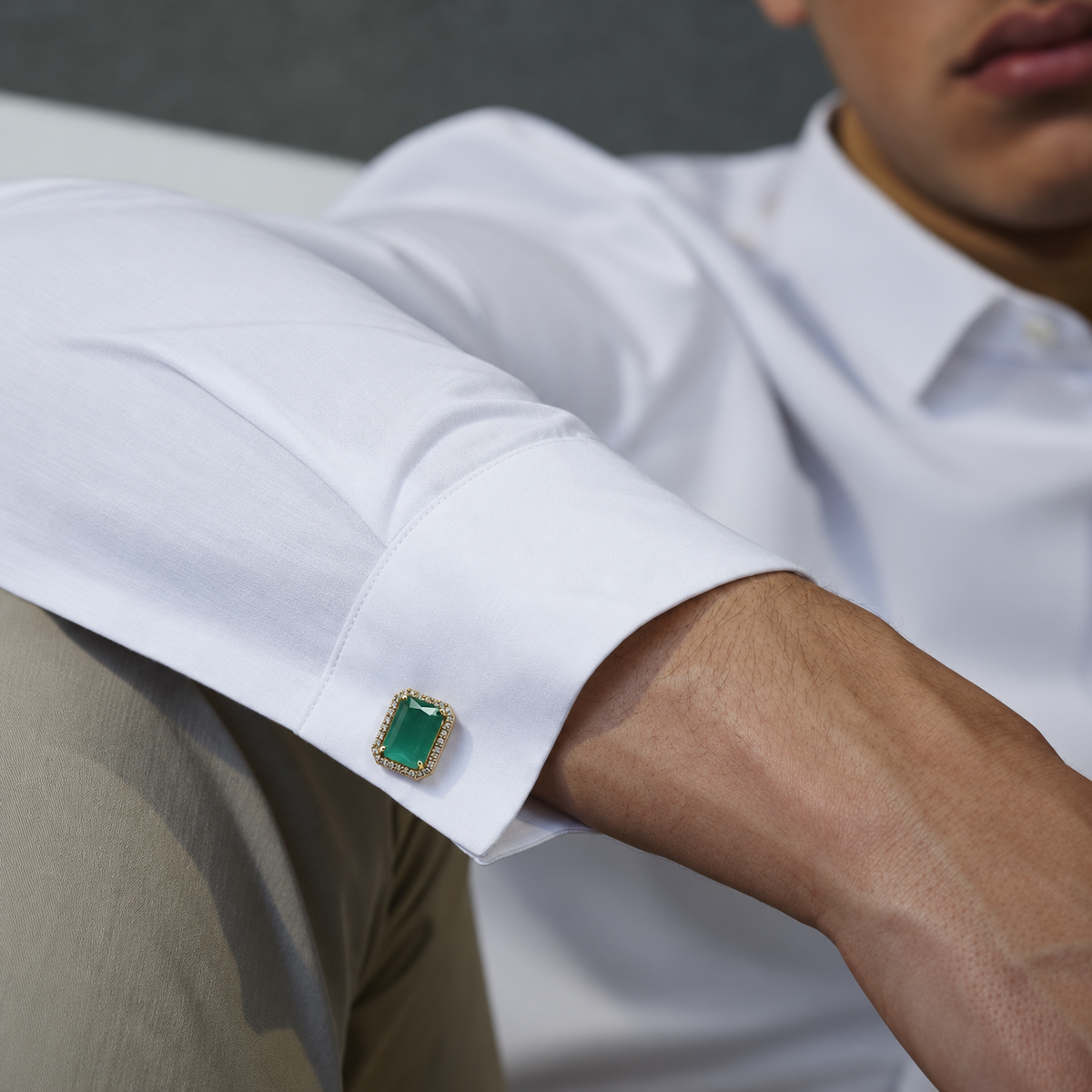 Lighter Green button cover cufflink worn on a white shirt cuff